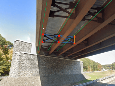 A steel girder bridge with cross-frame members connecting the girders